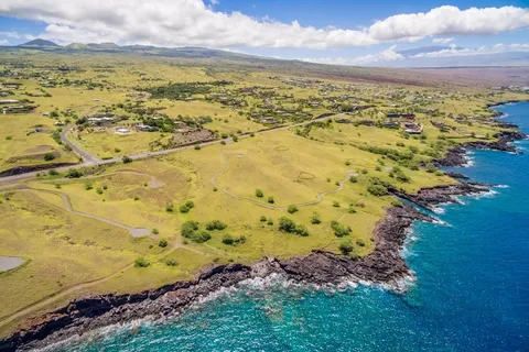 a view of a yard with an ocean