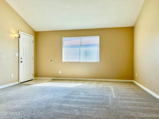 an empty room with a empty space and a window