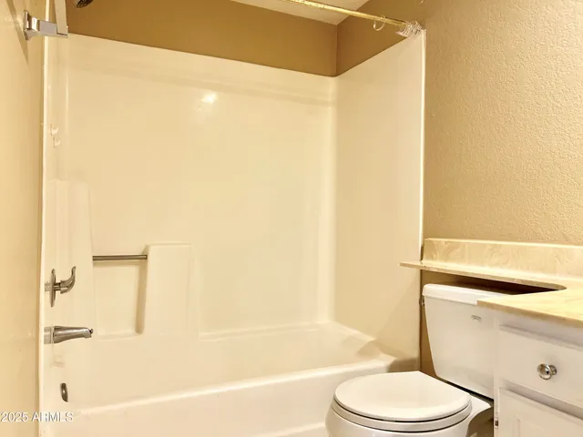 a bathroom with a bathtub and shower