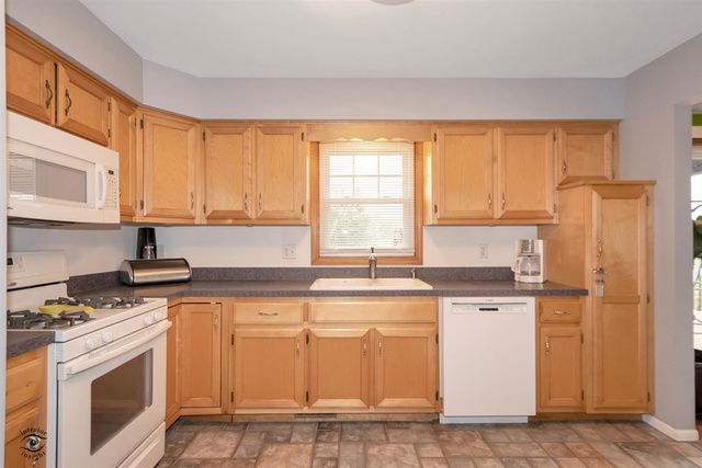 784 Darsha Road New Lenox, IL 60451 - Photo 11 of 21 a kitchen with stainless steel appliances granite countertop a stove a sink and white cabinets