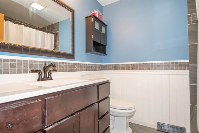 784 Darsha Road New Lenox, IL 60451 - Photo 14 of 21 a bathroom with a sink a toilet and mirror