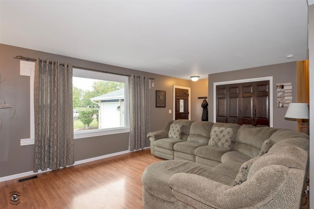 784 Darsha Road New Lenox, IL 60451 - Photo 3 of 21 a living room with furniture and a large window