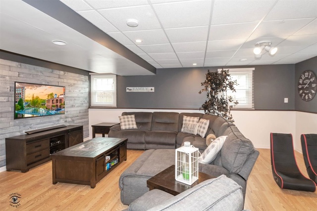 784 Darsha Road New Lenox, IL 60451 - Photo 7 of 21 a living room with furniture and a flat screen tv