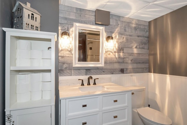784 Darsha Road New Lenox, IL 60451 - Photo 9 of 21 a bathroom with a sink a toilet and shower