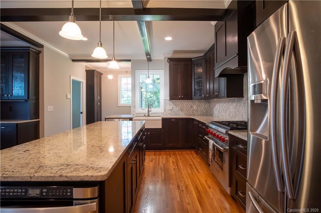 1844 Harris Road Charlotte, NC 28211 - Photo 11 of 29 a kitchen with stainless steel appliances granite countertop a sink stove and refrigerator