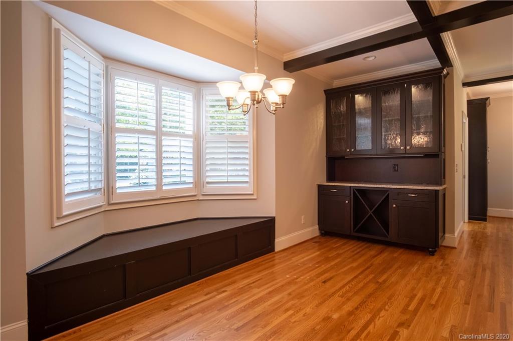 1844 Harris Road Charlotte, NC 28211 - Photo 14 of 29 a view of empty room with wooden floor and fan