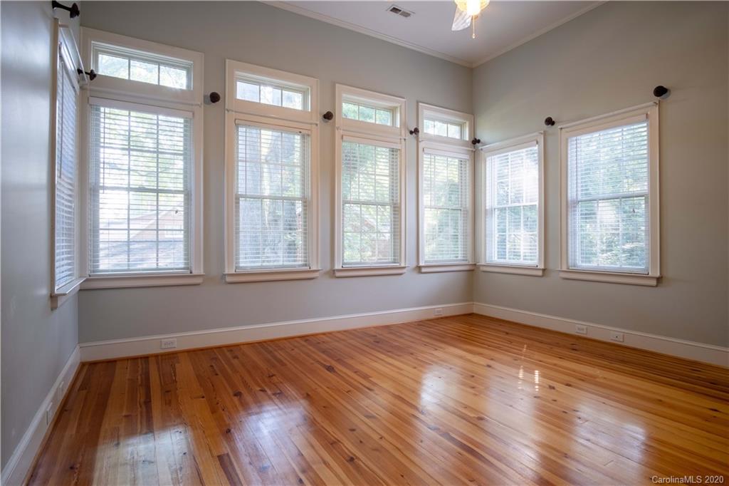 1844 Harris Road Charlotte, NC 28211 - Photo 16 of 29 a view of an empty room with wooden floor and a window