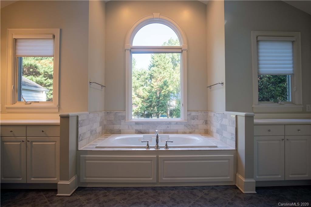 1844 Harris Road Charlotte, NC 28211 - Photo 17 of 29 a bathroom with bathtub and window