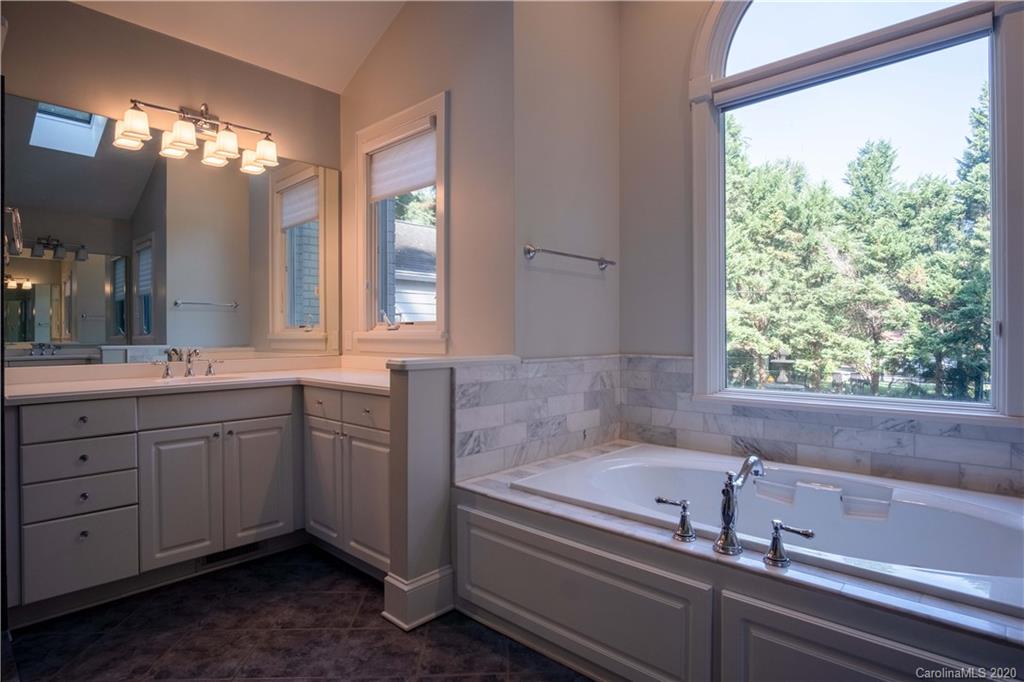 1844 Harris Road Charlotte, NC 28211 - Photo 18 of 29 a bathroom with a bathtub and a sink