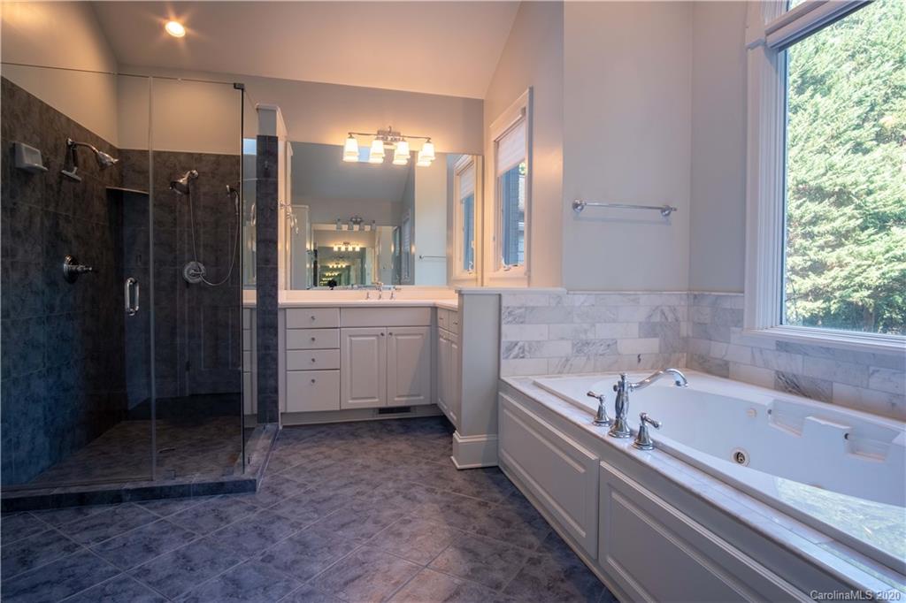1844 Harris Road Charlotte, NC 28211 - Photo 19 of 29 a bathroom with a bathtub and a shower
