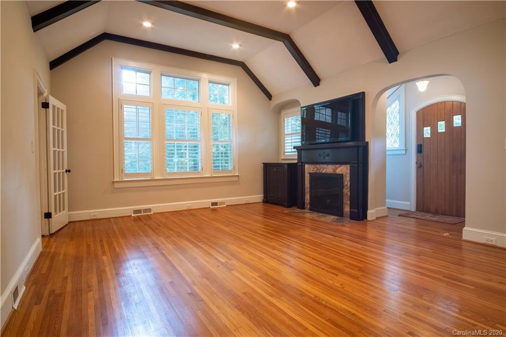 1844 Harris Road Charlotte, NC 28211 - Photo 4 of 29 a view of an empty room with window and wooden floor