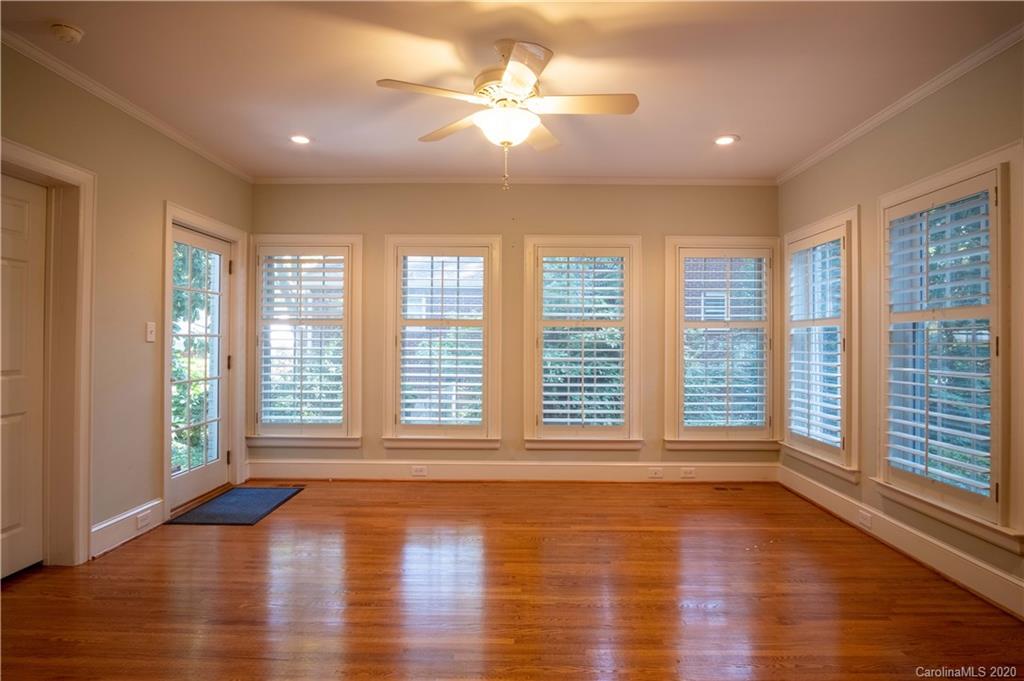 1844 Harris Road Charlotte, NC 28211 - Photo 6 of 29 a view of an empty room with wooden floor and a window