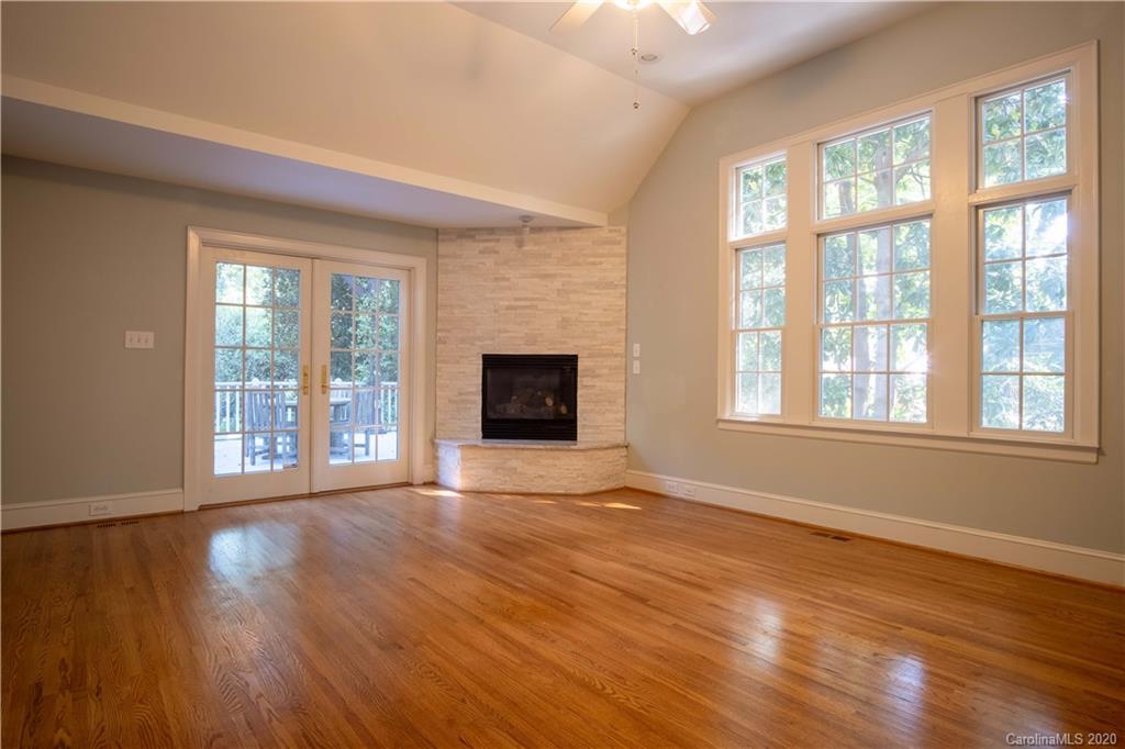 1844 Harris Road Charlotte, NC 28211 - Photo 7 of 29 a view of an empty room with wooden floor and a window