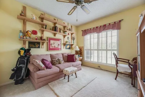 a living room with furniture and a window