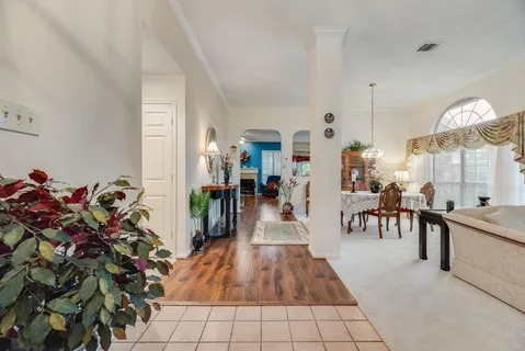 a view of a living room and dining room