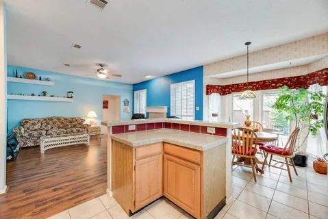a view of a kitchen and dining room