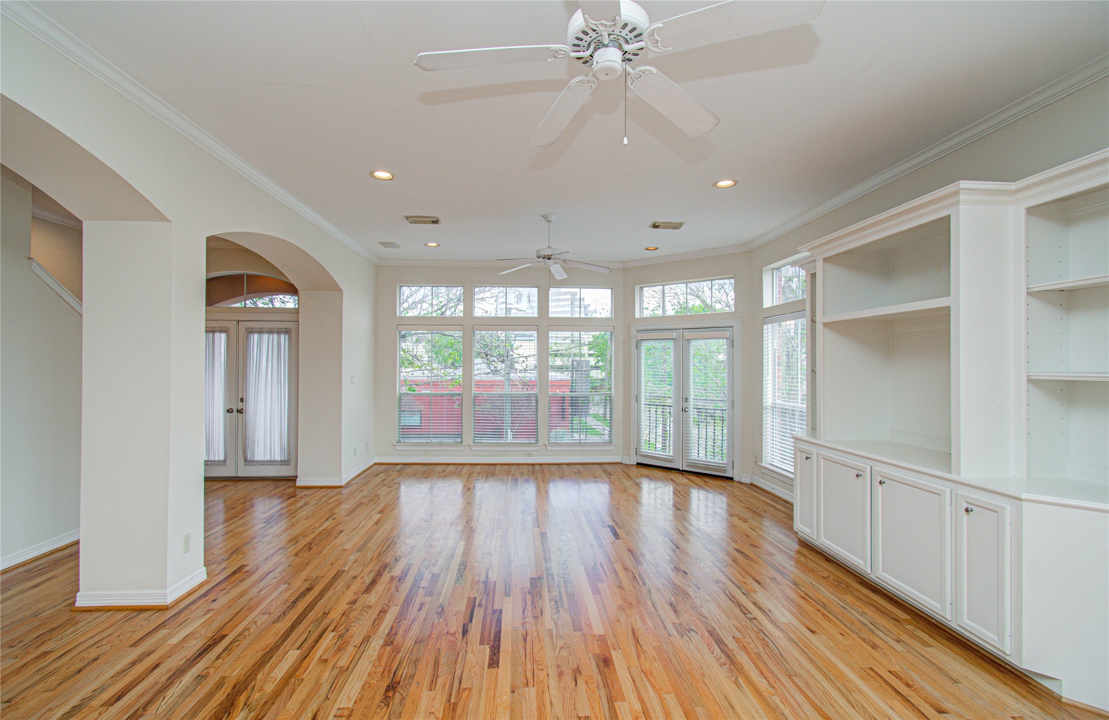 501 Leverkuhn Street Houston, TX 77007 - Photo 18 of 31 wooden floor in an empty room with a window