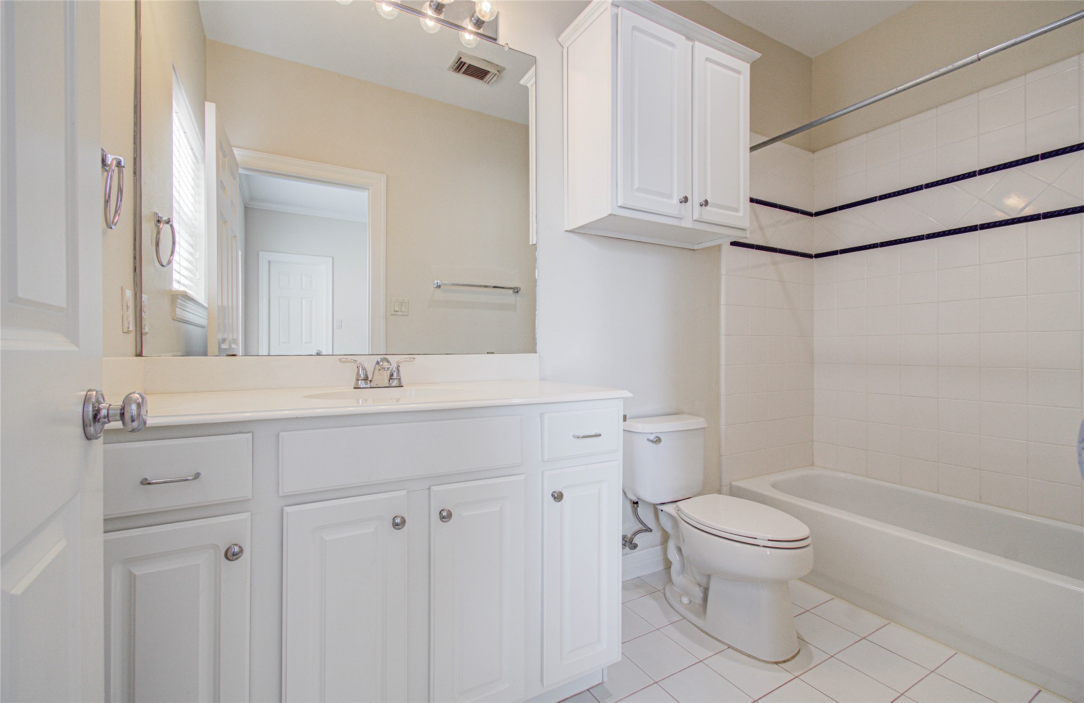 501 Leverkuhn Street Houston, TX 77007 - Photo 22 of 31 a bathroom with a sink a toilet and shower