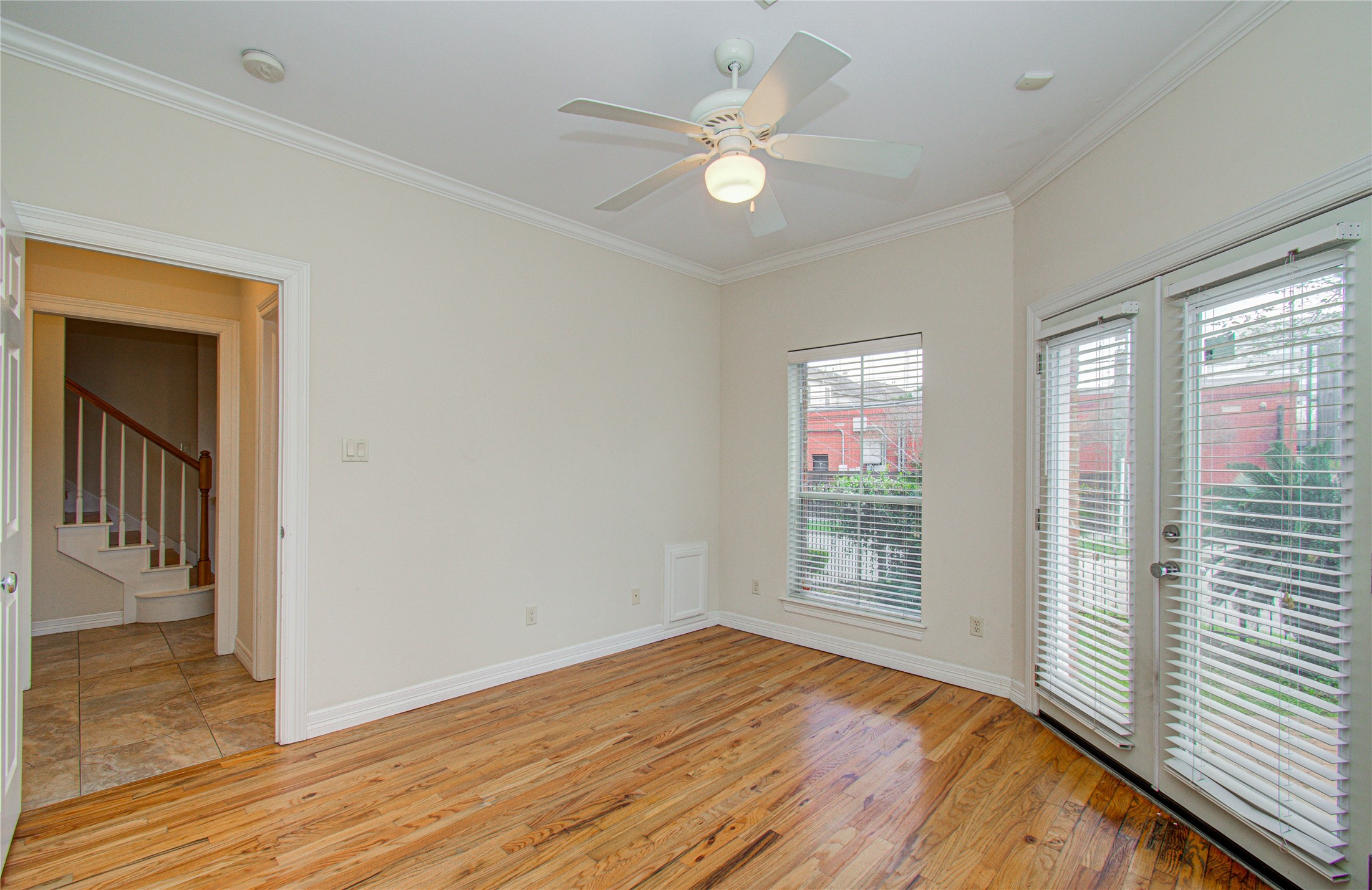 501 Leverkuhn Street Houston, TX 77007 - Photo 9 of 31 wooden floor in an empty room with a window