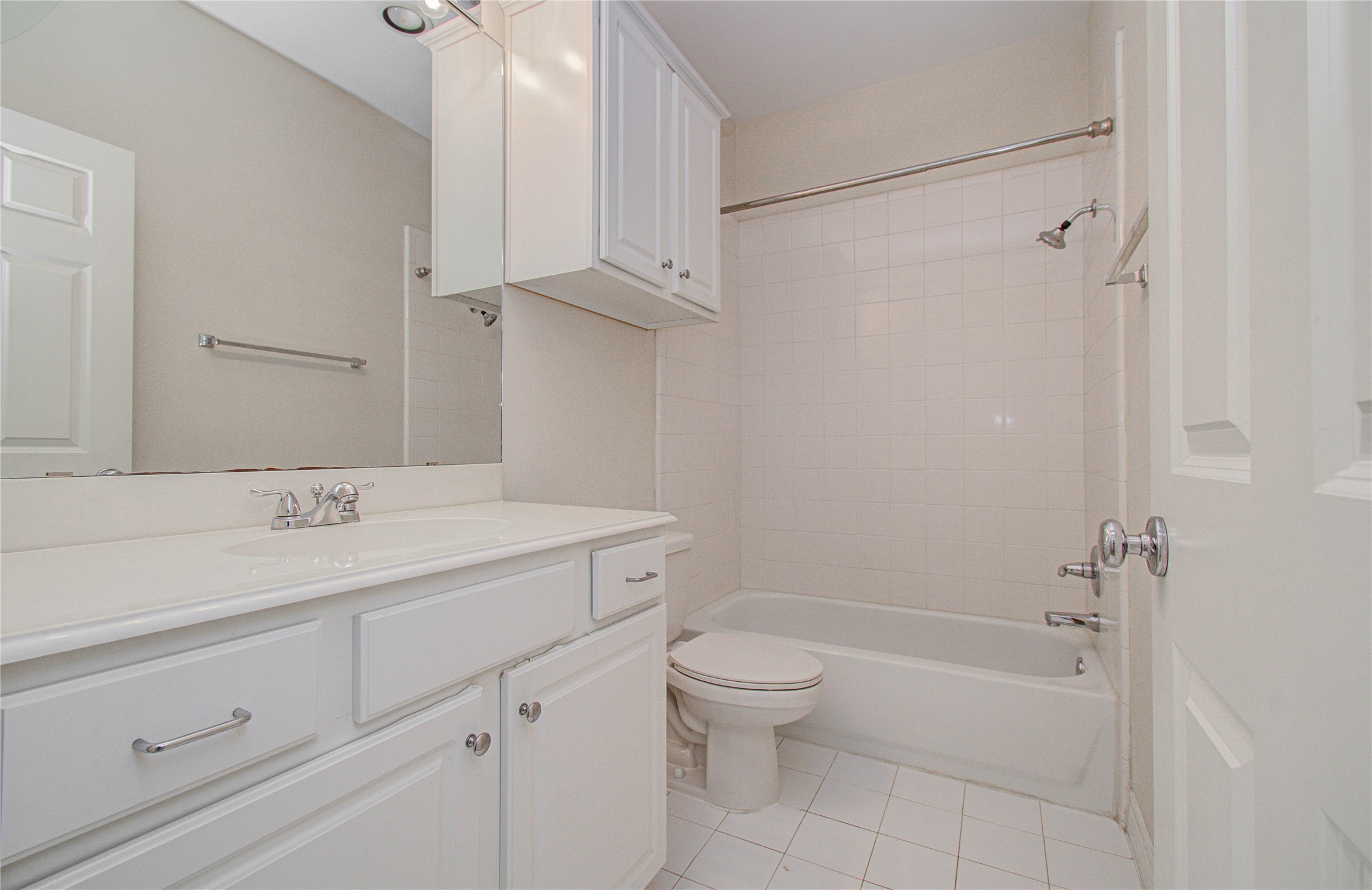 501 Leverkuhn Street Houston, TX 77007 - Photo 10 of 31 a bathroom with a sink a toilet and shower
