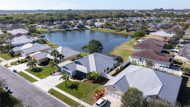 a kitchen with stainless steel appliances granite countertop a refrigerator and a stove
