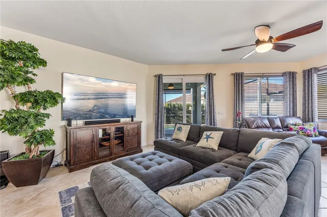 a view of livingroom with hardwood floor and a ceiling fan