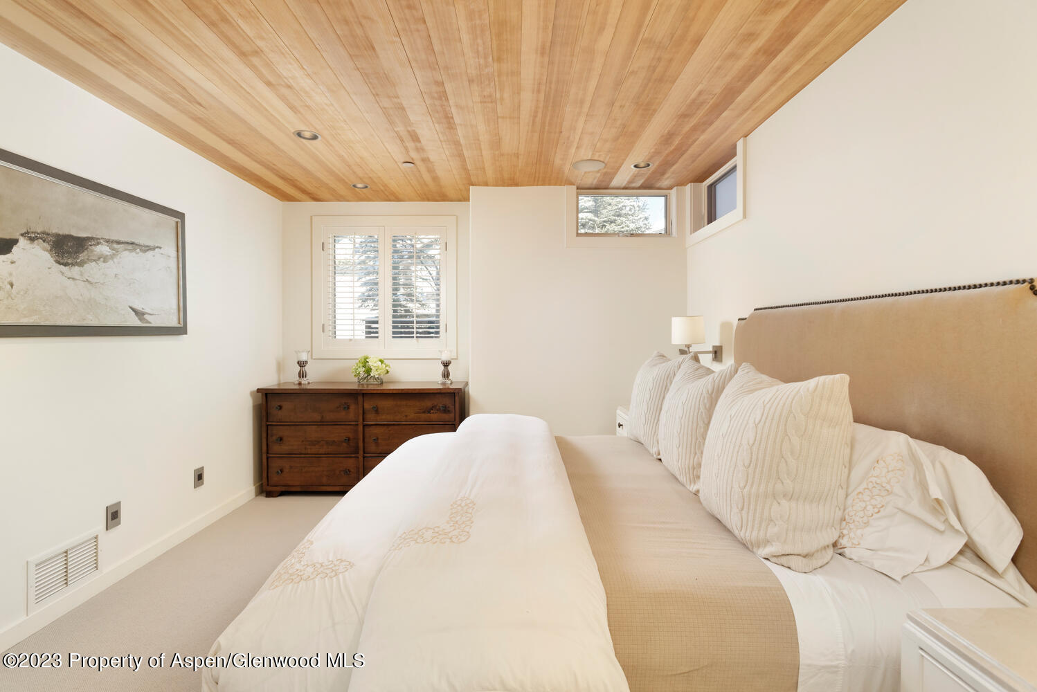 100 East Cooper Avenue, Unit 6 Aspen, CO 81611 - Photo 12 of 24 a bedroom with a bed and a window