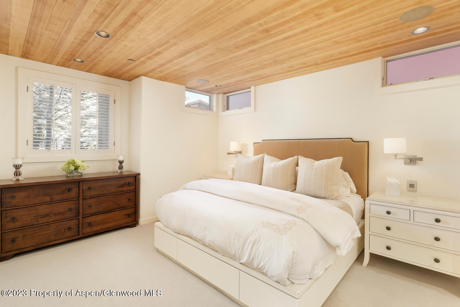 100 East Cooper Avenue, Unit 6 Aspen, CO 81611 - Photo 14 of 24 a bedroom with a bed and a dresser