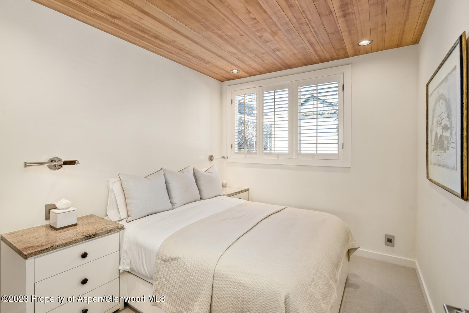 100 East Cooper Avenue, Unit 6 Aspen, CO 81611 - Photo 16 of 24 a bedroom with a bed and a window