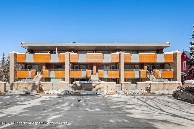 a front view of a building with a street