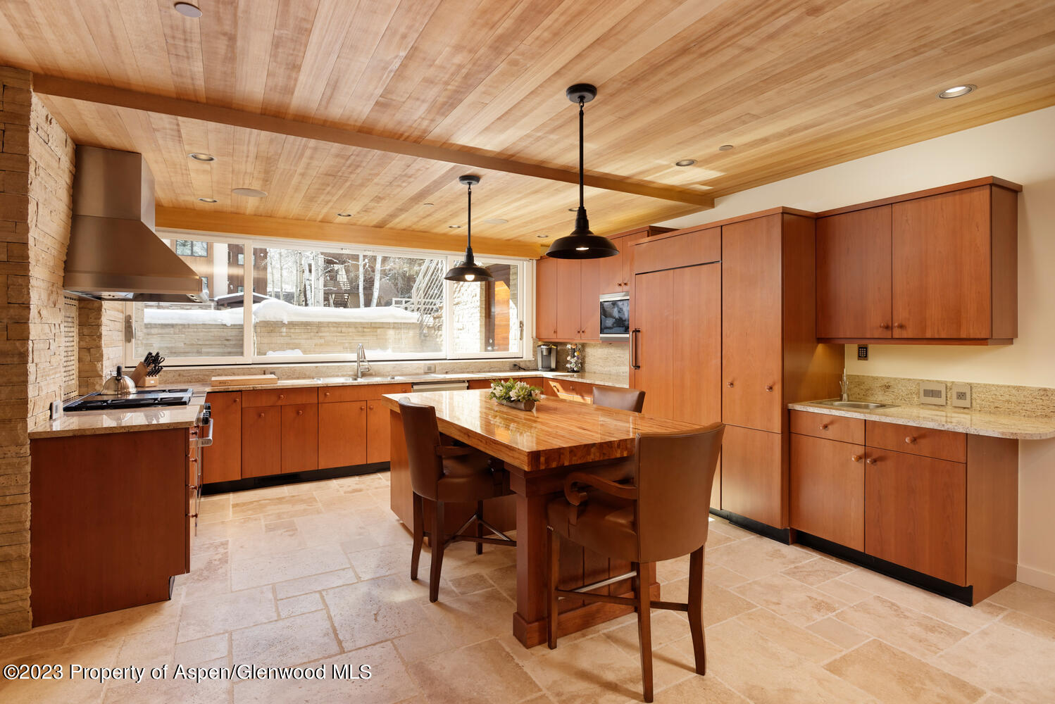 100 East Cooper Avenue, Unit 6 Aspen, CO 81611 - Photo 3 of 24 a kitchen with stainless steel appliances granite countertop a sink a stove and a refrigerator
