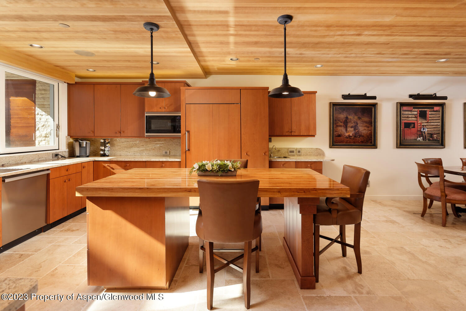 100 East Cooper Avenue, Unit 6 Aspen, CO 81611 - Photo 4 of 24 a kitchen with a table chairs and a wooden floor