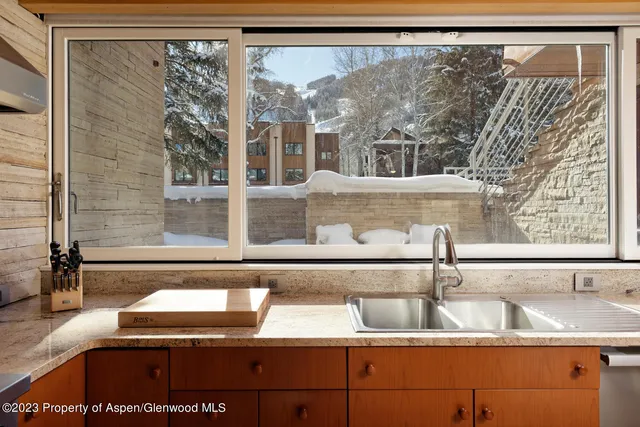 a bathroom with a sink and a large mirror