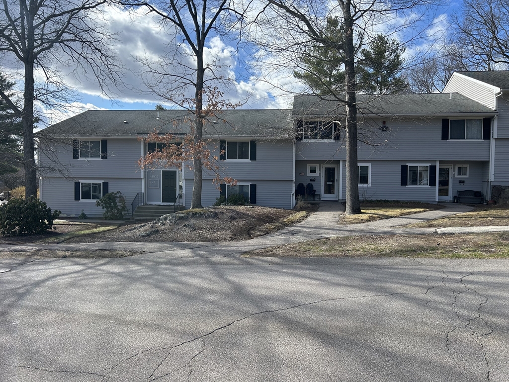 7 Beal's Cove Road, Unit 7A Hingham, MA 02043 - Photo 2 of 8 a view of a white house with a large tree