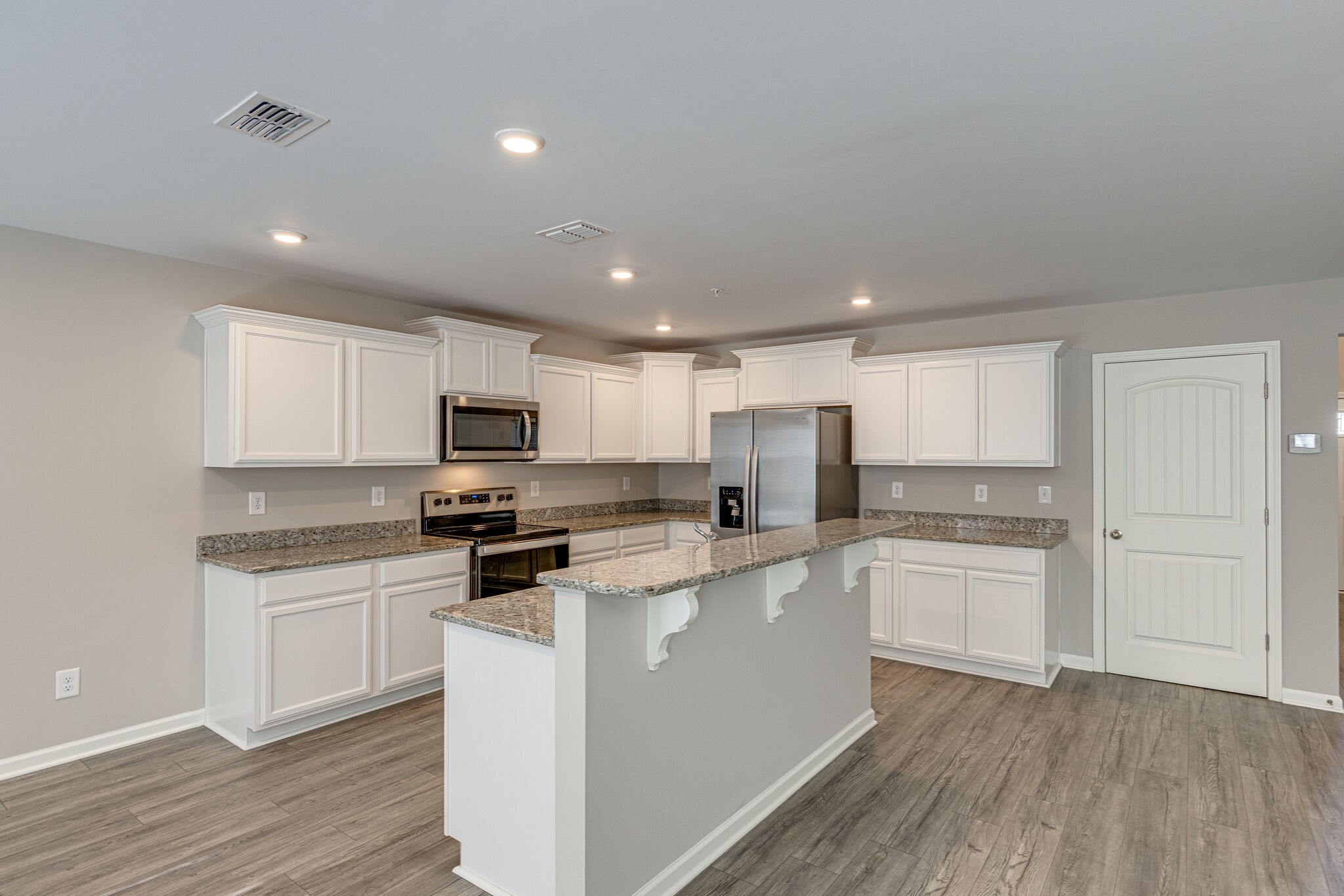 312 Mattie Ln Spring Hill Spring Hill, TN 37174 - Photo 11 of 37 a kitchen with white cabinets stainless steel appliances and sink