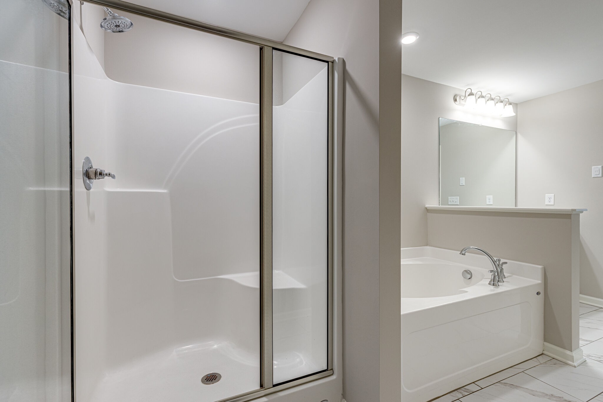 312 Mattie Ln Spring Hill Spring Hill, TN 37174 - Photo 22 of 37 a bathroom with a bathtub and a shower