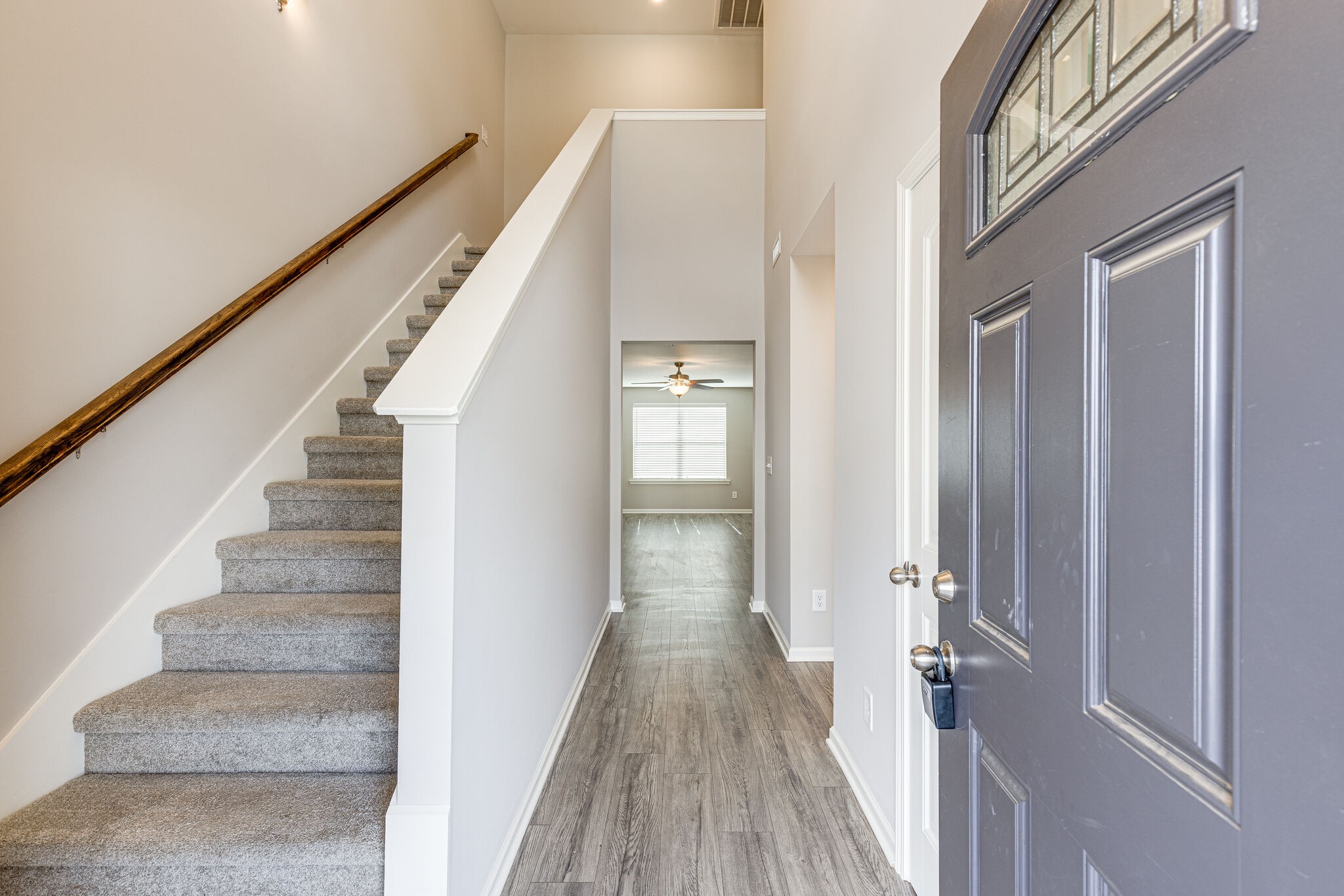 312 Mattie Ln Spring Hill Spring Hill, TN 37174 - Photo 3 of 37 a view of a hallway with wooden floor and staircase