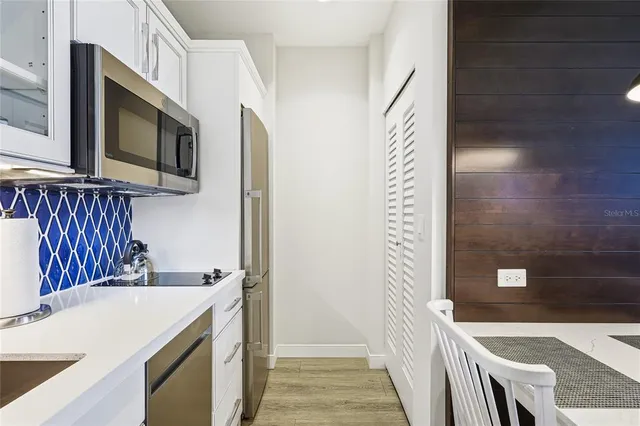 a kitchen with a sink and a microwave