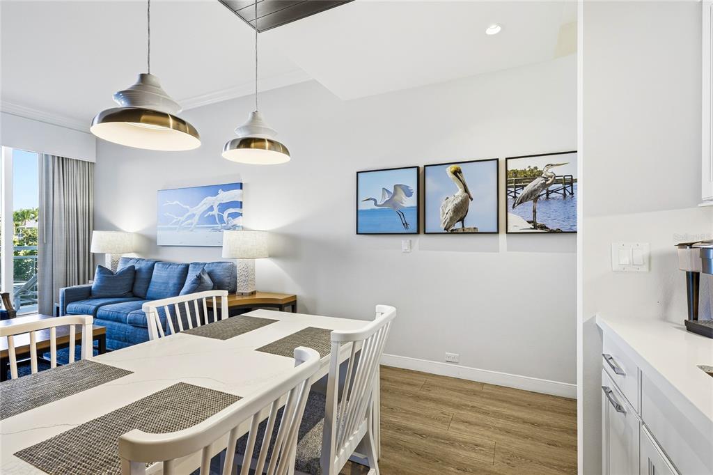 225 Sands Point Road, Unit 7101 Longboat Key, FL 34228 - Photo 14 of 44 a view of a dining room with furniture