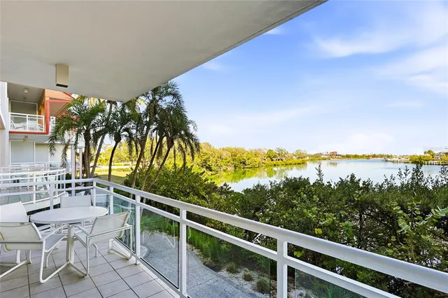 a view of a balcony with lake view and mountain view