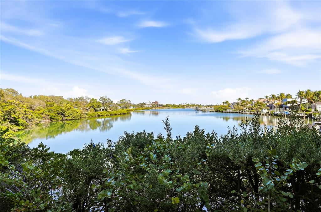 225 Sands Point Road, Unit 7101 Longboat Key, FL 34228 - Photo 22 of 44 a view of a lake from a yard