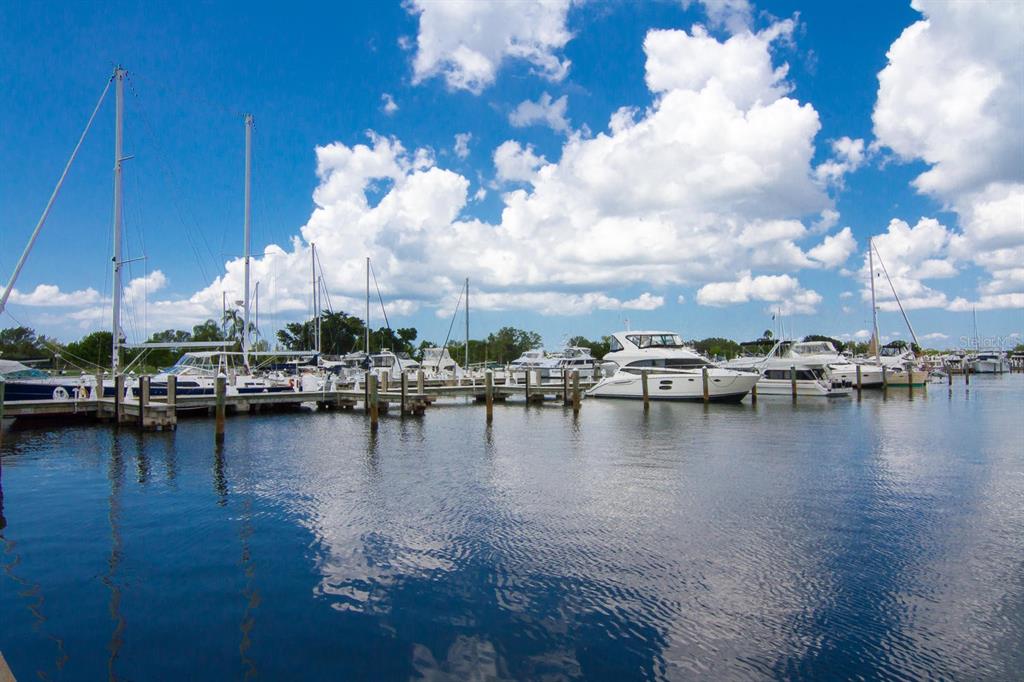 225 Sands Point Road, Unit 7101 Longboat Key, FL 34228 - Photo 31 of 44 a view of a lake with boats and trees in the background