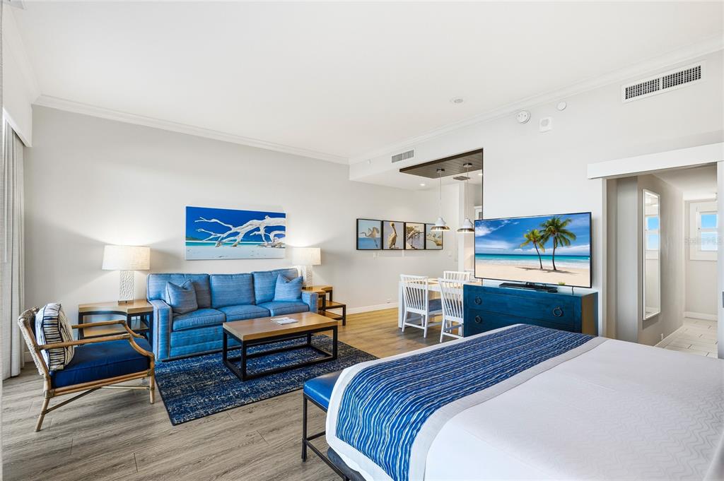 225 Sands Point Road, Unit 7101 Longboat Key, FL 34228 - Photo 7 of 44 a bedroom with a bed and a view of kitchen