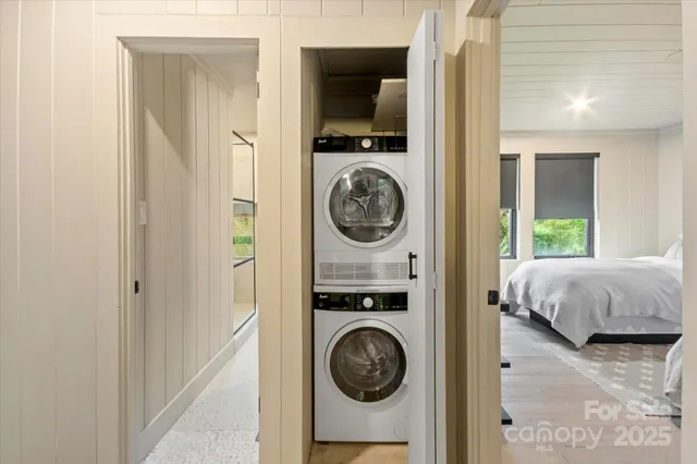 a front view of a house with a garden and yard