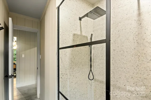 a view of a house with a yard and large tree