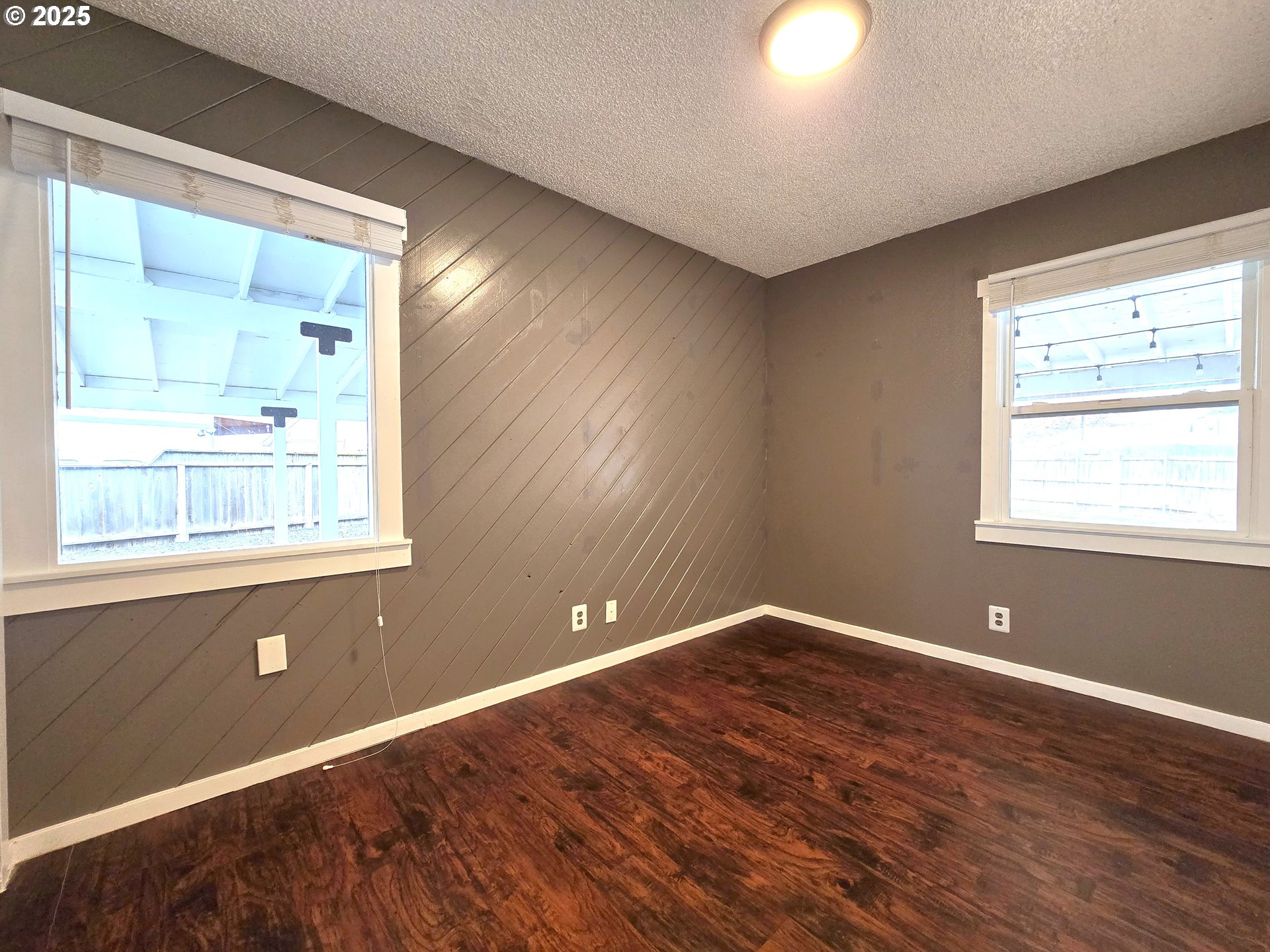 460 East Sunset Drive Hermiston, OR 97838 - Photo 15 of 32 a view of an empty room with wooden floor and a window