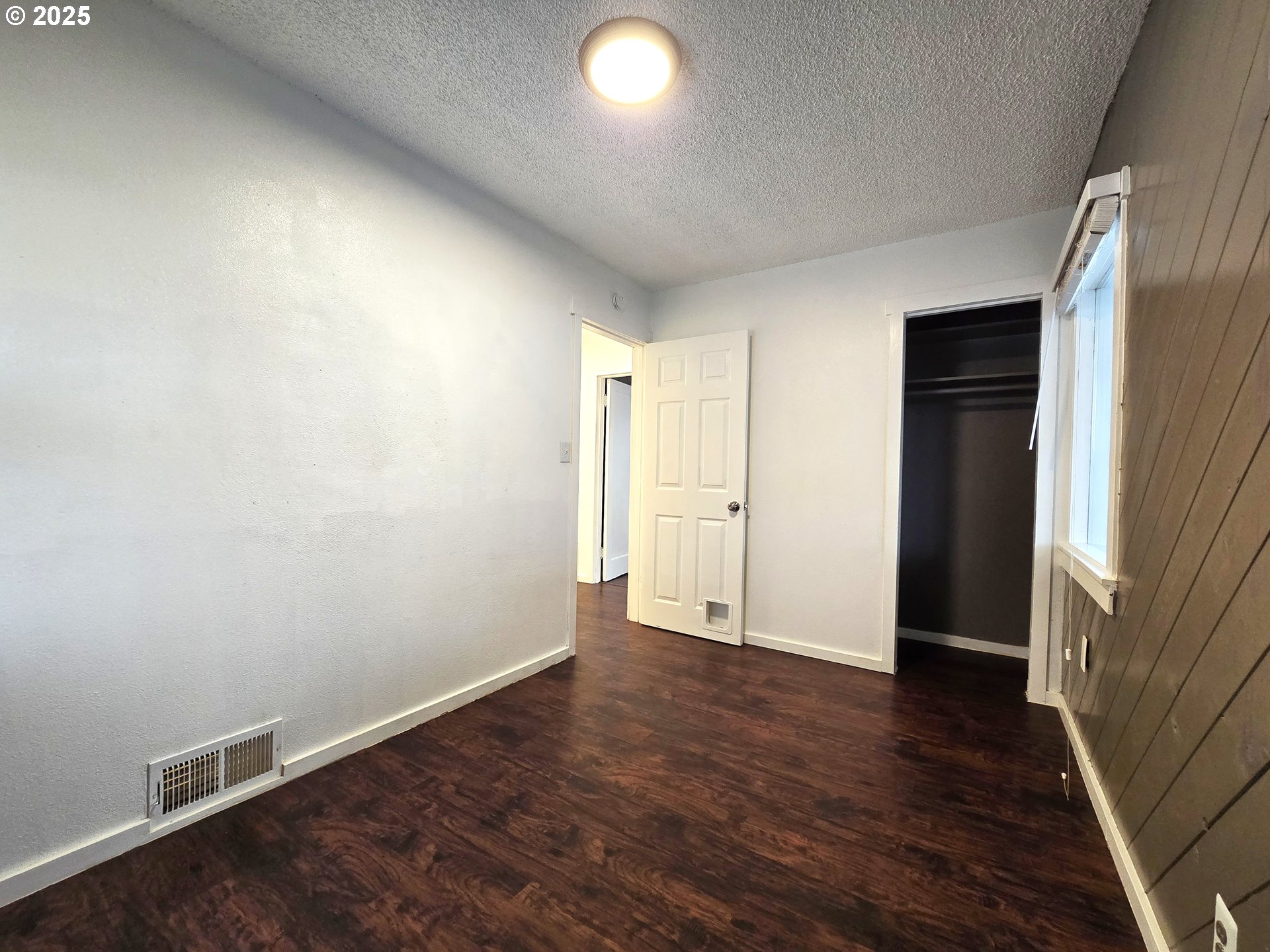 460 East Sunset Drive Hermiston, OR 97838 - Photo 16 of 32 an empty room with wooden floor and closet