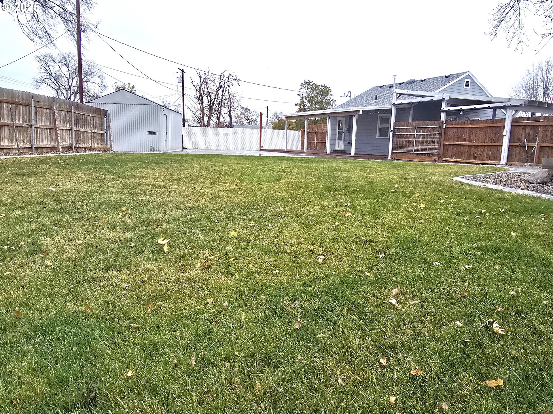 460 East Sunset Drive Hermiston, OR 97838 - Photo 26 of 32 a view of a house with a yard and sitting area