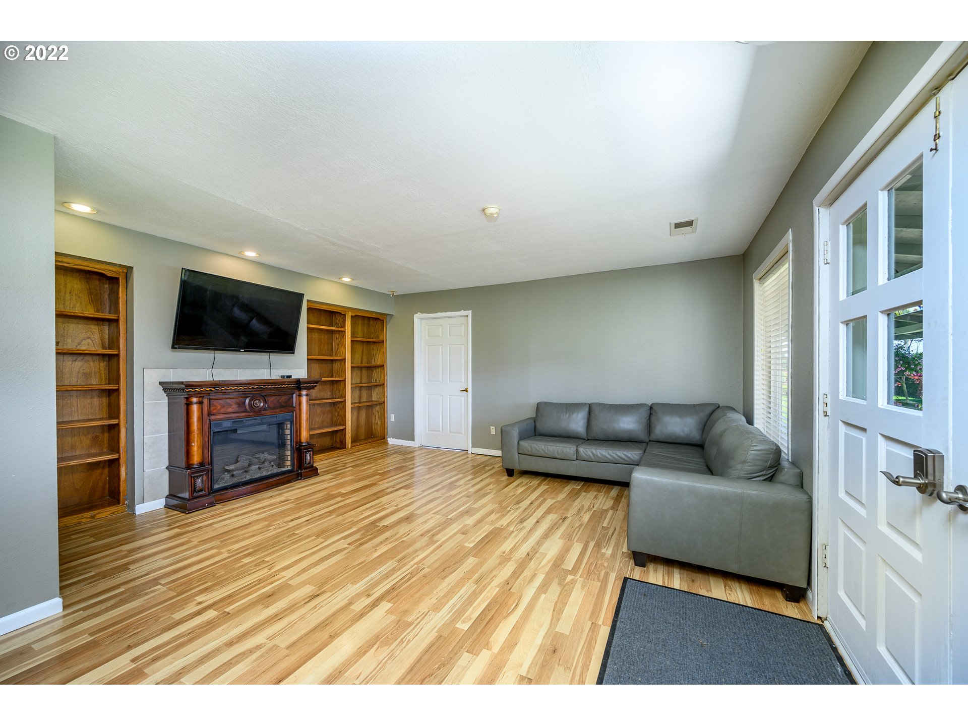 16041 Southeast Unionvale Road Dayton, OR 97114 - Photo 8 of 31 a living room with furniture and a fireplace