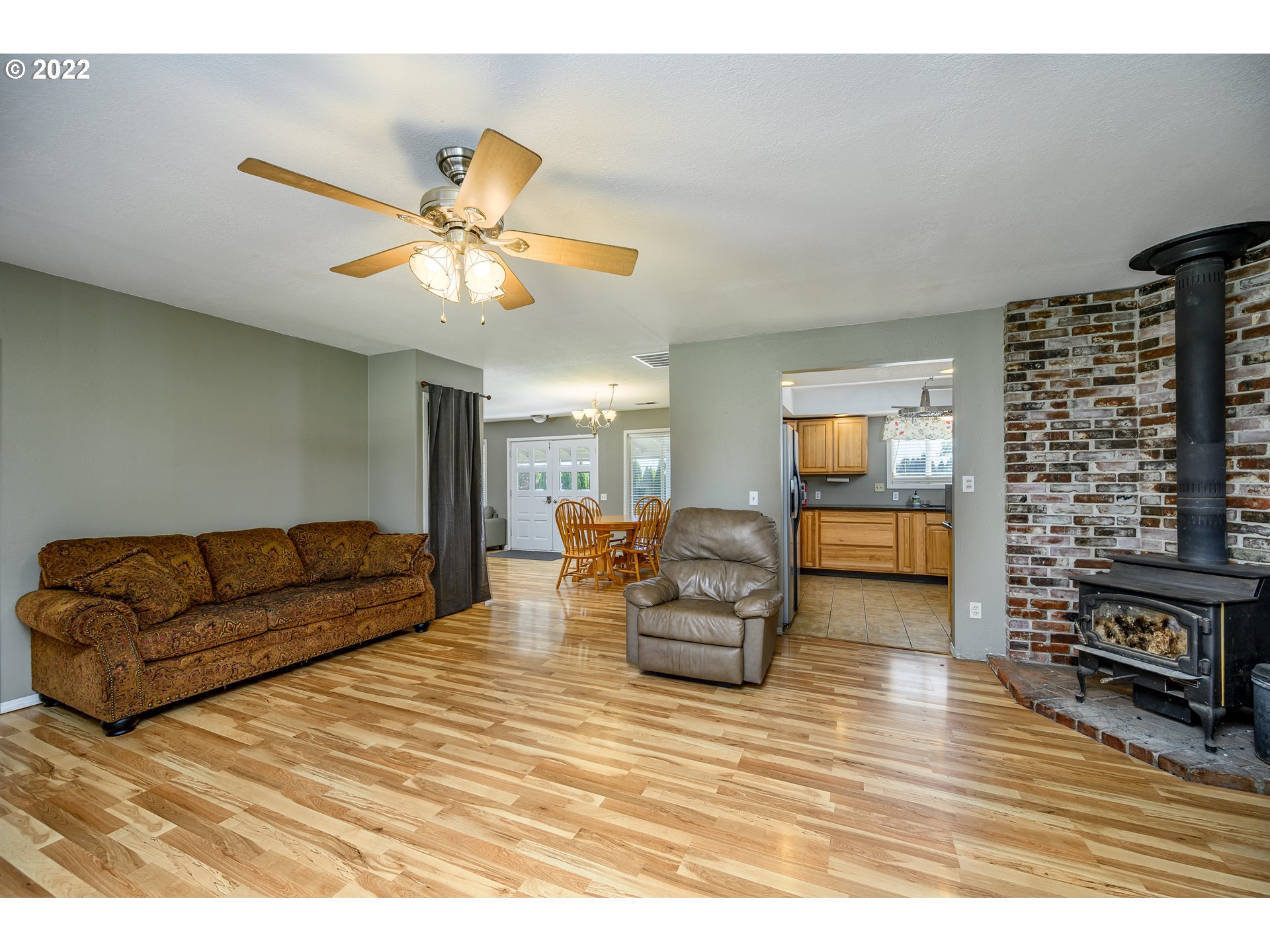16041 Southeast Unionvale Road Dayton, OR 97114 - Photo 10 of 31 a living room with furniture and a wooden floor